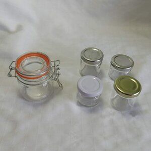 4 small empty jam jars and an airtight small glass jug